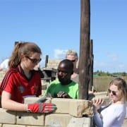  SERVE volunteers building alongside students at Dondo (Moz)