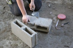 Splitting bricks for use in the construction of the creche kitchen