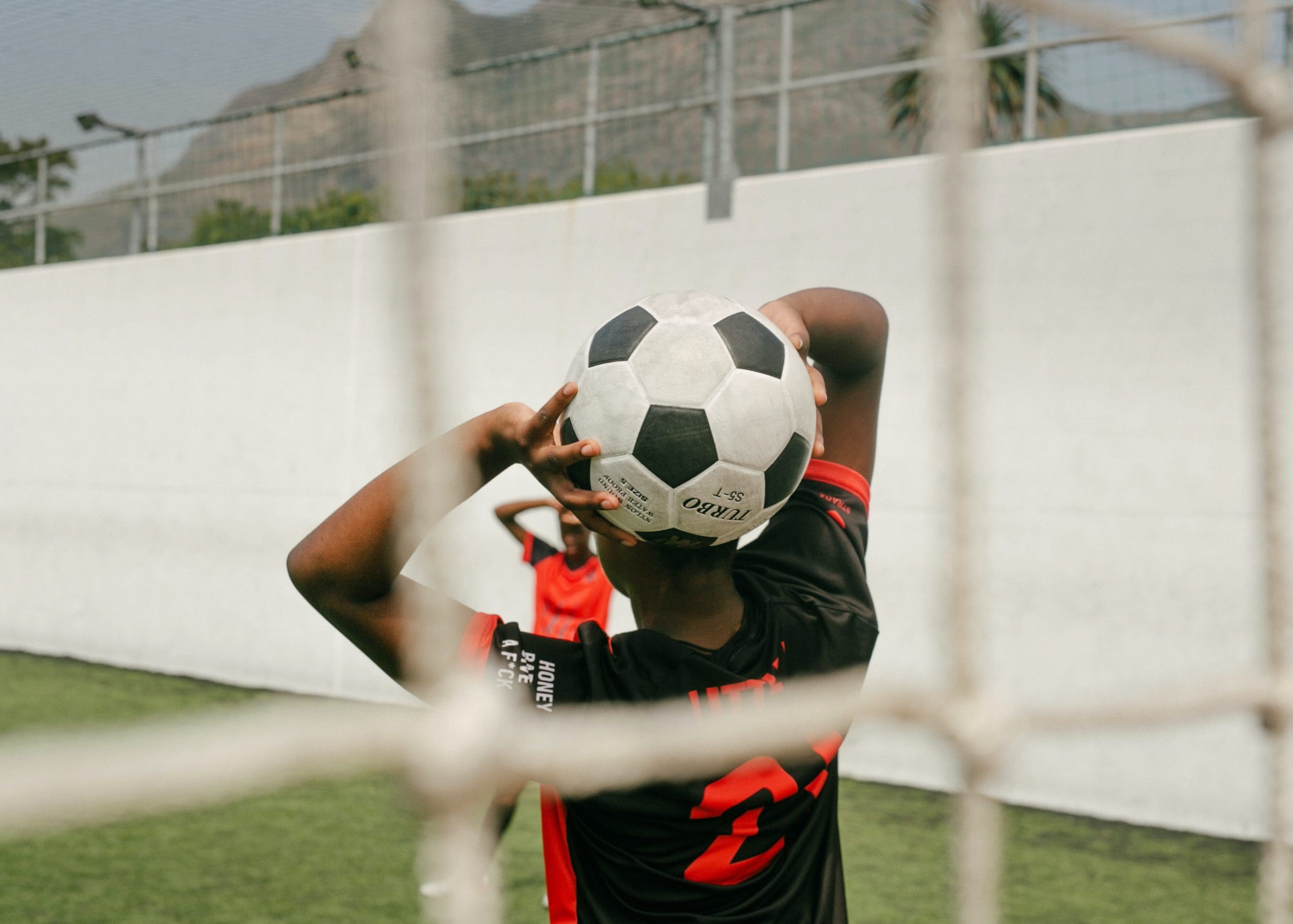 Photo by RF._.studio: https://www.pexels.com/photo/a-player-holding-a-soccer-ball-3886252/