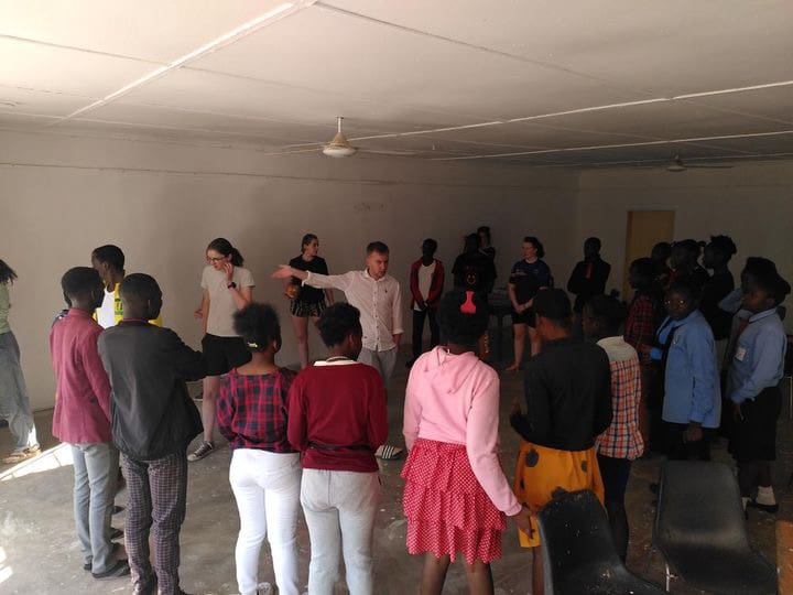 SERVE volunteer with group of young people in Zambia