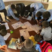 SERVE volunteer with group of young children in Zambia