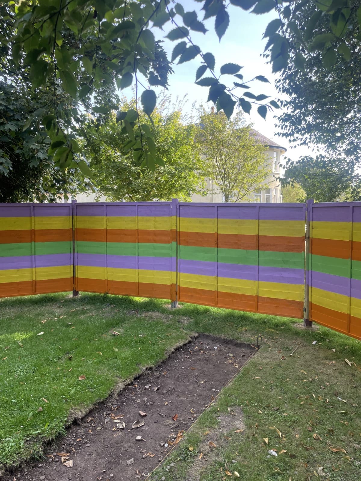 Painted fence in the Scala Sensory Garden